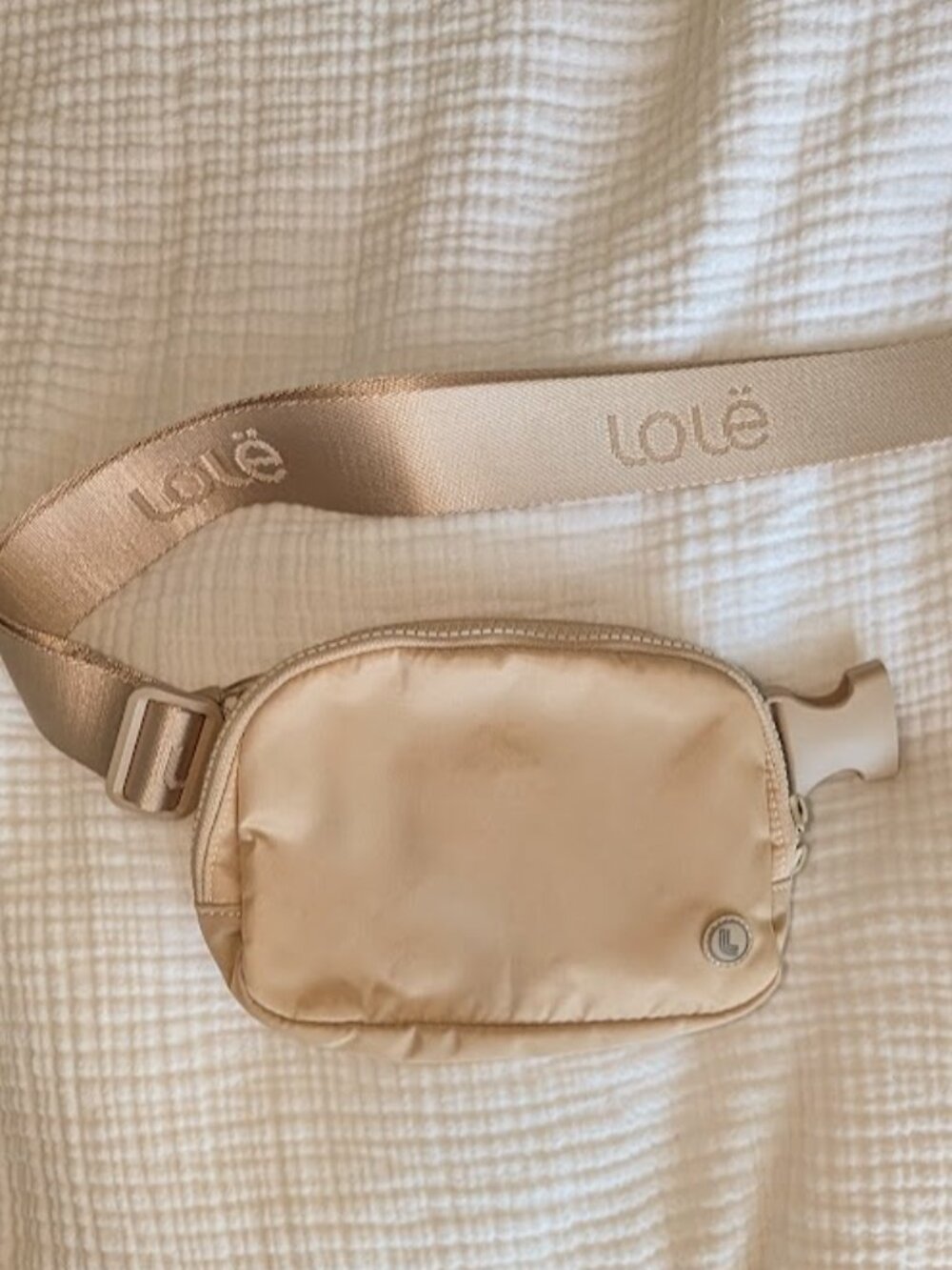 Lolë Belt Bag – Beige Waist Pack with Adjustable Logo Strap